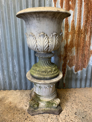 A very large acanthus urn on a column pedestal