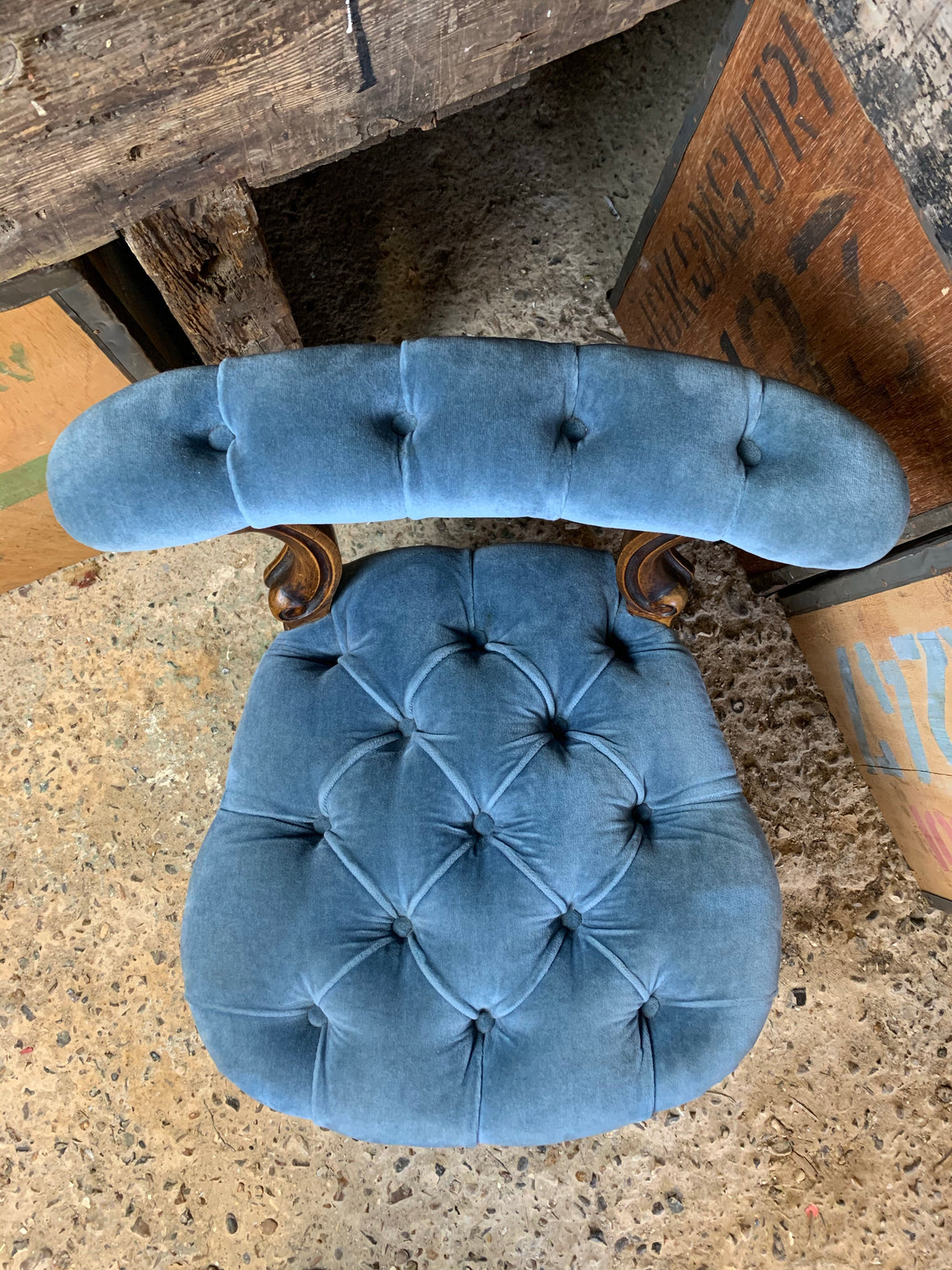 A blue velvet button back and seat Prie Dieu chair on castors