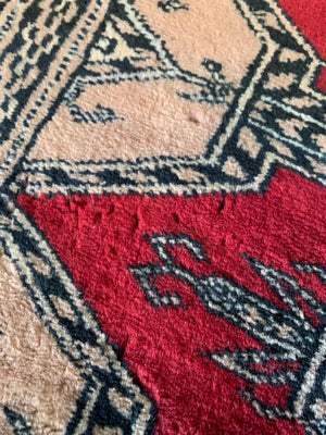 A large hand woven Jaldar red ground rectangular rug - pure virgin wool