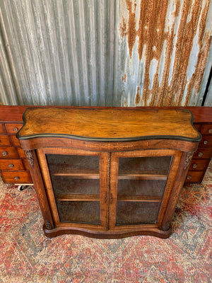 A Victorian double fronted serpentine pier cabinet