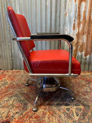 A chrome barber's chair ~ swivel and tilt