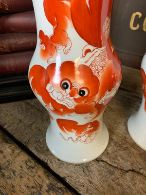 A pair of Chinese ceramic foo dog vases