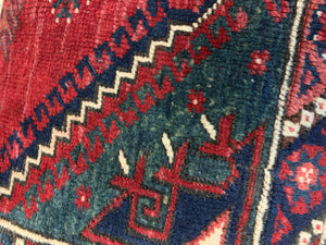 A large rectangular Persian carpet floor cushion