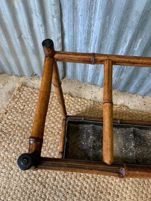 A bamboo stick stand with metal liner