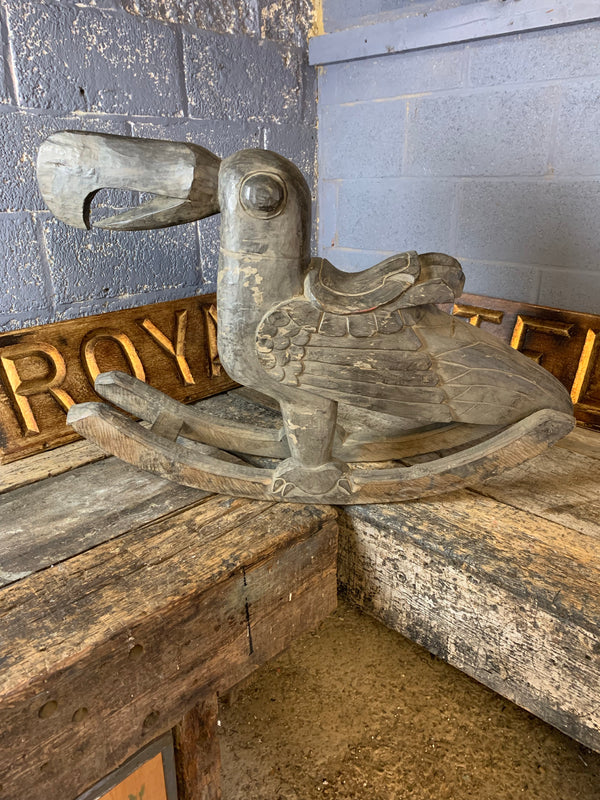 A hand-carved wooden rocker in the form of a toucan - Belle and Beast ...