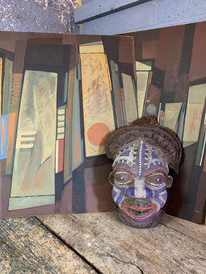 A carved wood African Bamum mask from Cameroon