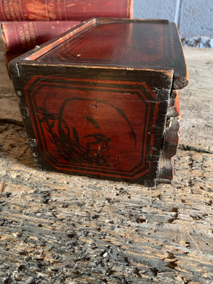 A carved wooden Chinese box with dragon motifs