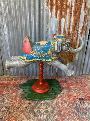 A child's ride on elephant mounted as a fairground galloper