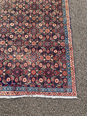 A Persian blue and brown ground rectangular rug