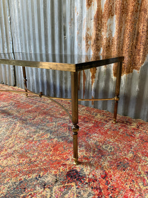 A brass and glass Hollywood Regency coffee table