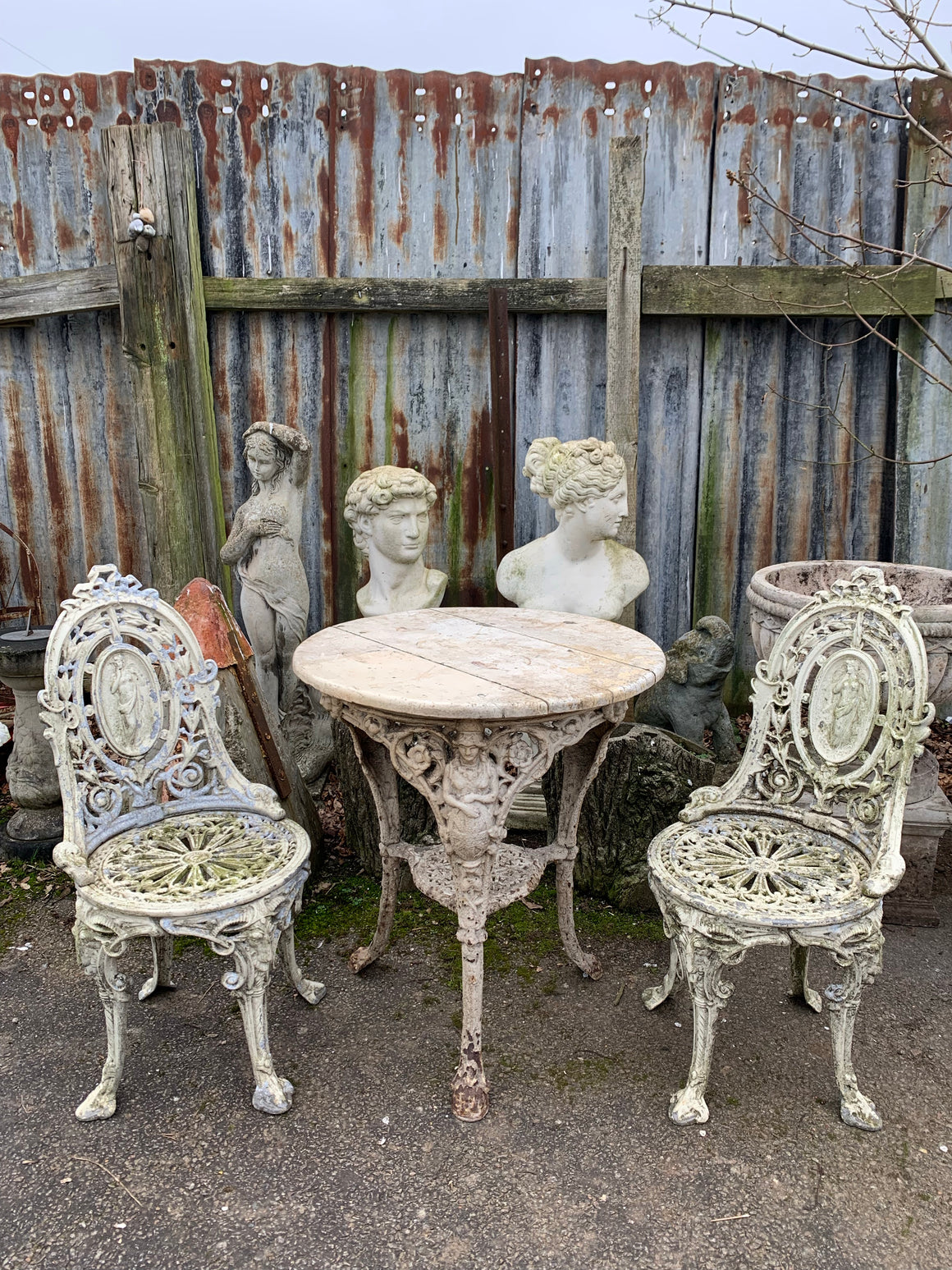 A white cast iron Britannia Abolitionist garden table with 2 chairs