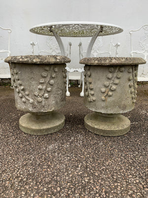 A pair of modernist cast stone garden planters