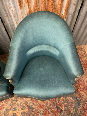 A pair of blue French chairs