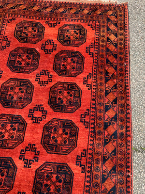 A sunset red ground Bokhara rectangular rug- 200cm x 135cm