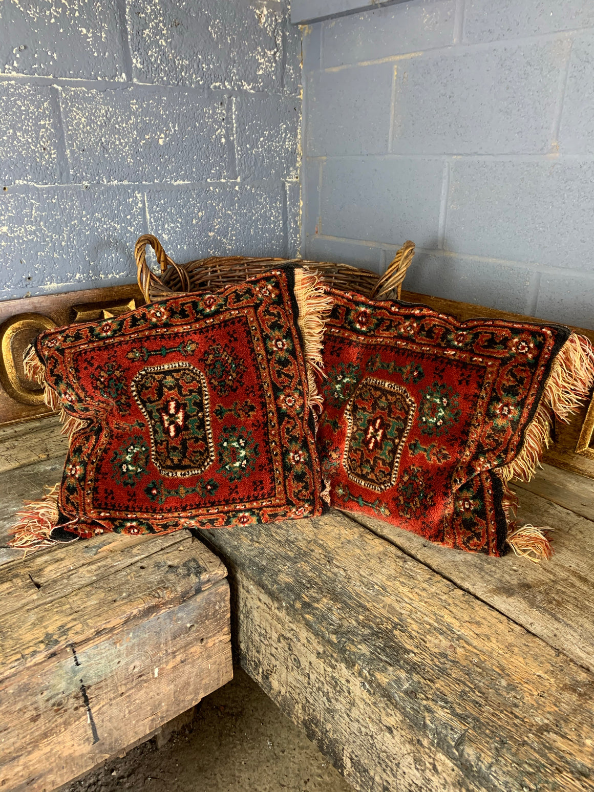 A large red ground Persian carpet cushion - 50cm