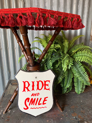 A hand painted fairground advertising sign - Ride and Smile
