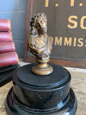 A small bust of Jesus in the Ecce Homo aspect