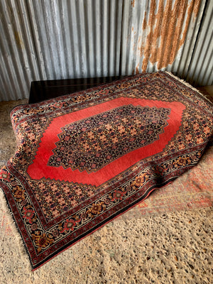 A red ground Sanandaj rug - 197cm x 128cm