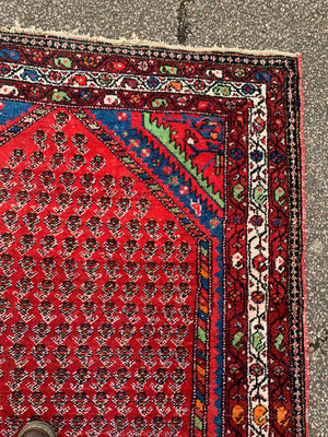 A red ground Sharashan rug - 205cm x 138cm