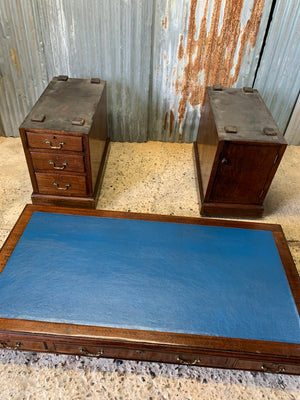 A blue leather pedestal desk