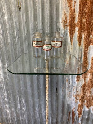A large cast iron and glass shop display stand