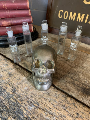A collection of five squared apothecary bottles