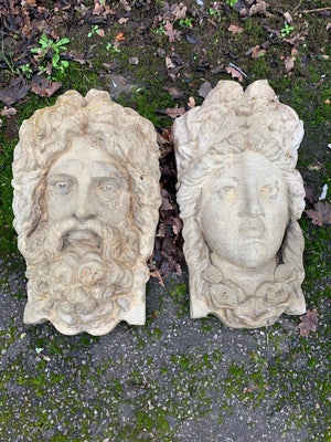 A pair of cast stone plaques of Neptune and Amphitrite