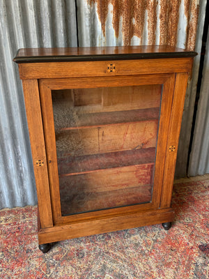 A Victorian single door inlaid pier display cabinet