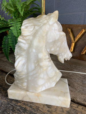 An alabaster and marble horse head table lamp