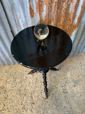 An ebonised wooden bobbin gypsy table