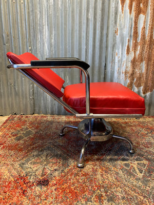 A chrome barber's chair ~ swivel and tilt