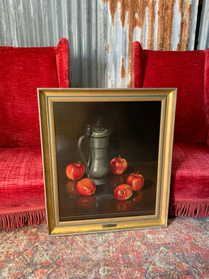 A large still life oil painting of apples and a tankard