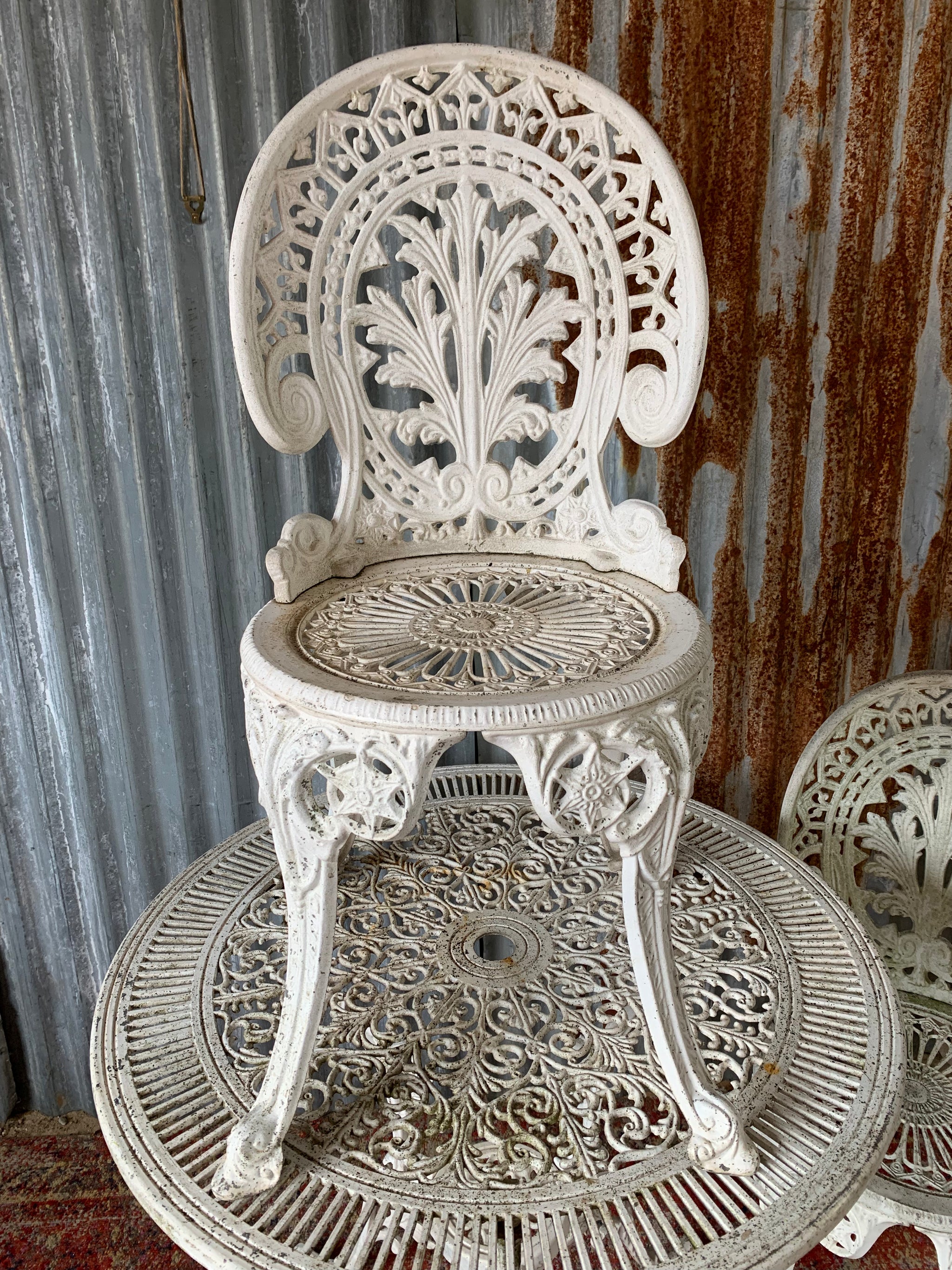 A white Victorian style table and two chairs garden set Belle