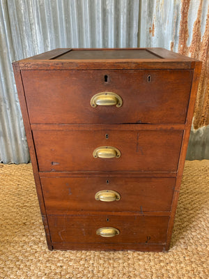 A bank of 4 drawers by Martin & Co.
