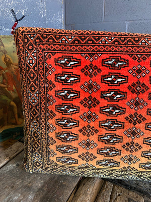A very large red ground Persian carpet cushion - 92cm x 52cm
