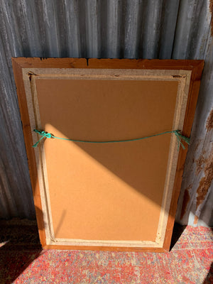 A large rectangular ebonised mirror