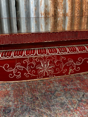 A red lacquered chinoiserie coffee table