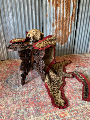 A profusely carved Anglo-Indian table by Jubbar Khan & Son