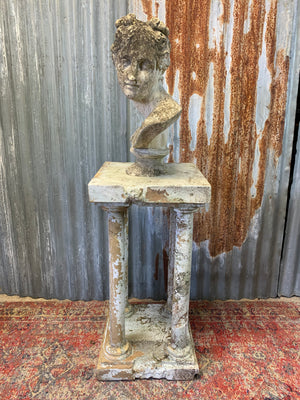 A faux marble neoclassical pedestal stand