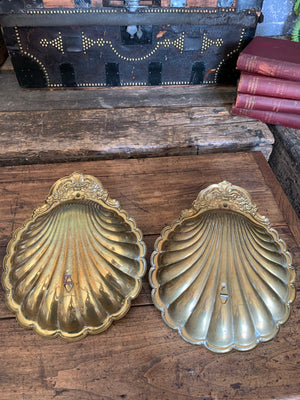A pair of very large brass shell candlestick wall sconces