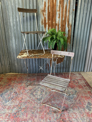 A white metal folding garden set - table and two chairs