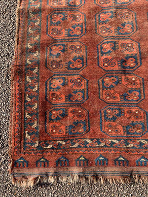A Persian brown ground rectangular Bokhara rug