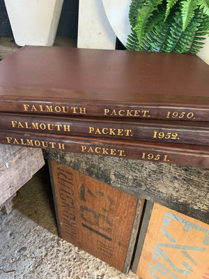 A leather-bound volume of the Cornwall Falmouth Packet newspaper