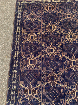 A midnight blue ground rug - 217cm x 115cm