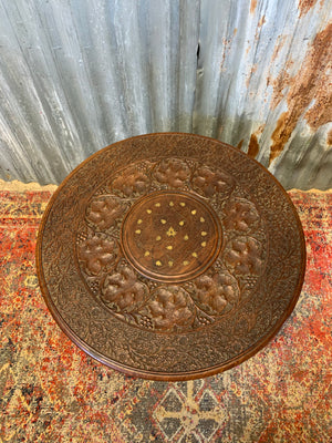 An Anglo-Indian circular carved table with brass inlay