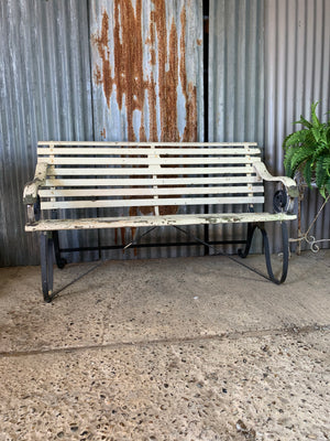 A 19th Century wrought iron and wood garden bench