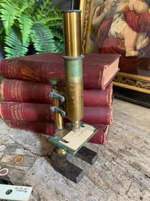 A 19th Century brass monocular microscope by E Leitz Wetzler with slides