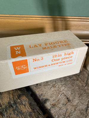 A 12" boxed wooden artist's lay figure by Winsor and Newton