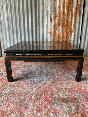 A black lacquered chinoiserie square coffee table