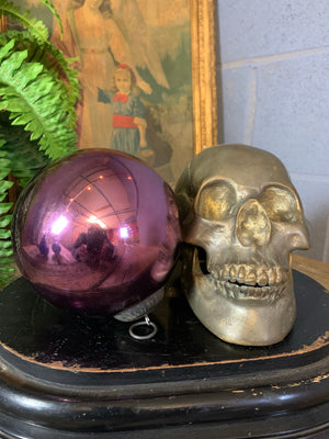 A pink glass witch's ball